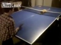 Boy and Cat playing Ping Pong.